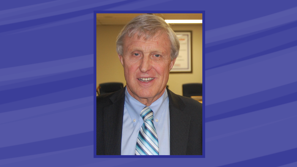 image of a blue background with a photo in the center of Dr. Griff Powell.